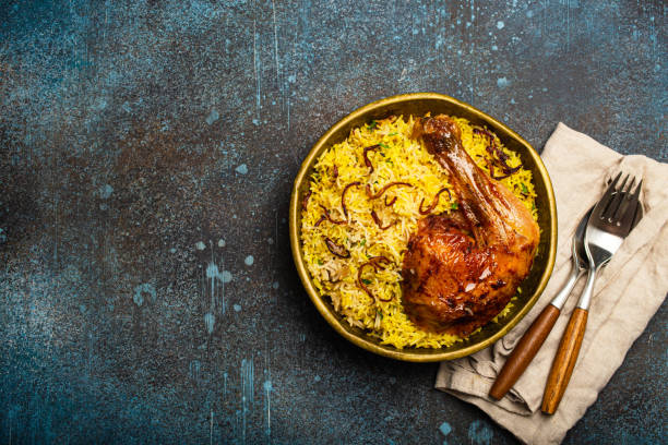 istock Indian dish Biryani chicken with basmati rice in metal brass old bowl on table 1722901318