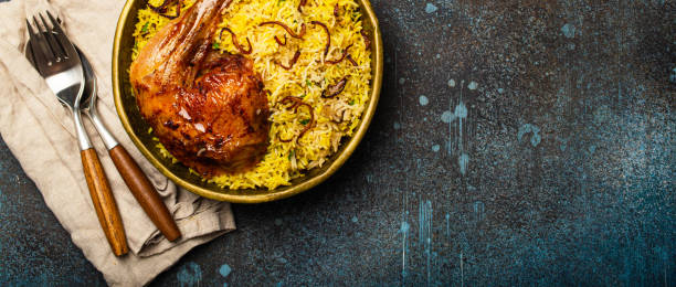 istock Indian dish Biryani chicken with basmati rice in metal brass old bowl on table 1722901319