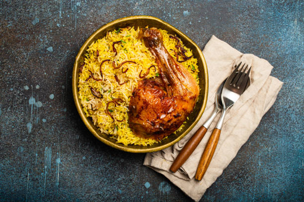 istock Indian dish Biryani chicken with basmati rice in metal brass old bowl on table 1722901326