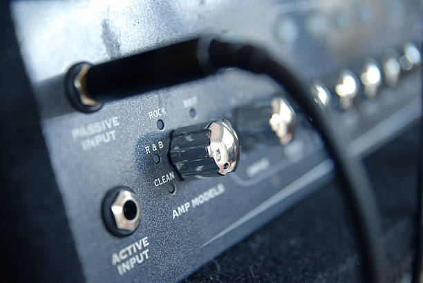 istock Electric bass guitar combo (amplifier) with black cable, rock music 172290164