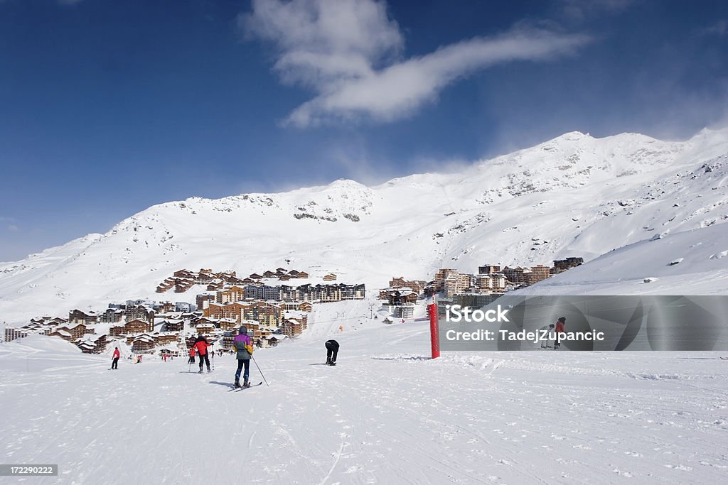 Skiing towards the village Val Thorens. Apartment Stock Photo