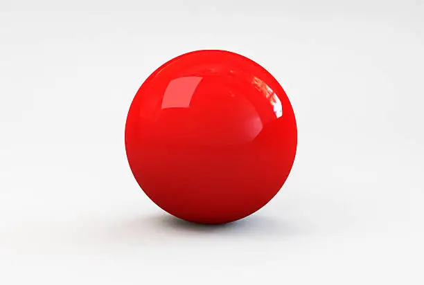 Photo of A shiny red ball with shadow on a white background