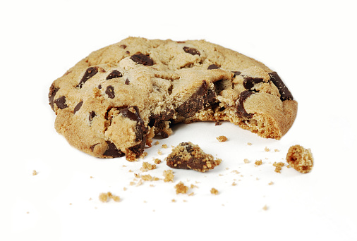 Close-up of a chocolate chip cookie with a bite