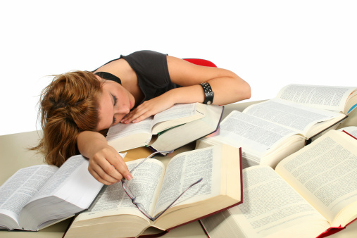 Student girl sleeping on the books