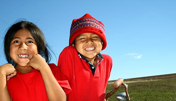 Red Happy Latin Littles Latin littles.VIEW SERIES: Sun Kissed Cute red white blue bike stock pictures, royalty-free photos & images