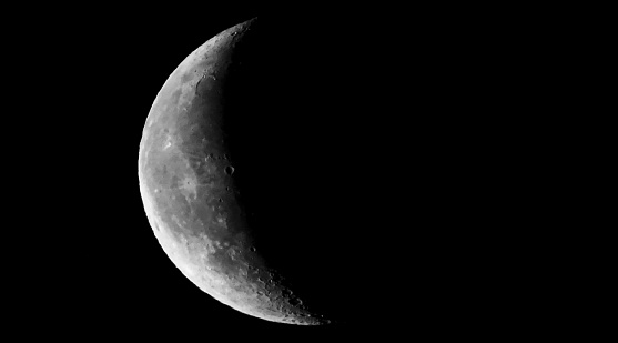 Here is depicted a waning moon, shot in mid June 2023, in Dusseldorf, Germany, optimized for graphic applications and with a considerable amount of negative space, in order to add further elements of image and / or text if need.