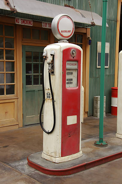 antique gas pump antique gas pump with station vintage gas pumps stock pictures, royalty-free photos & images