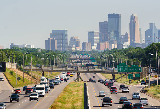 istock Busy Traffic on Multiple Lane Highway with Minneapolis, Minnesota Skyline 172293837