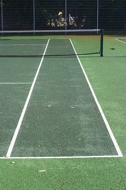 A view down the line on a tennis hard court. Perspective. Surrey, UK.