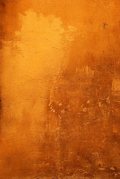 Florentine Canvas Detail of an old weathered building in Florence Italy. burnt orange paint stock pictures, royalty-free photos & images