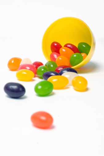 Jelly Beans Spilling from a Yellow Plastic Egg