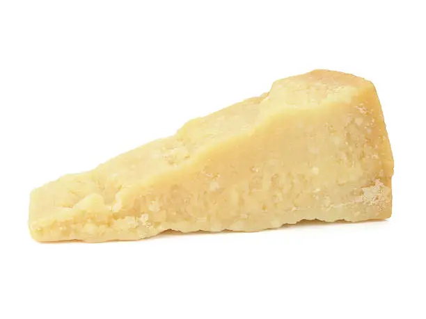 Slice of Parmesan cheese isolated on white. Clipping path included to remove shadow or place object on other background.See also: