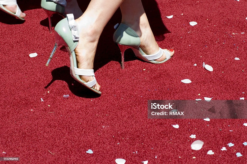 Red carpet event Woman walking on red carpet with confetti Red Carpet Event Stock Photo