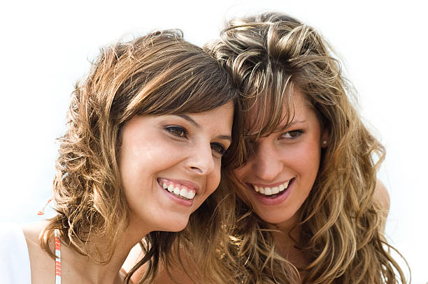 istock Two young attractive women giggling and flirting 172295351