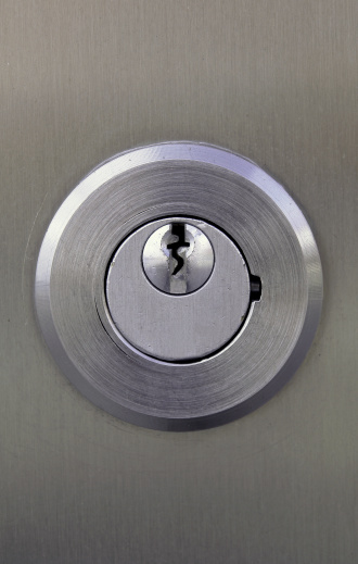 Steel door lock keyhole.