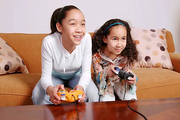 Two sisters go head-to-head in a video game.