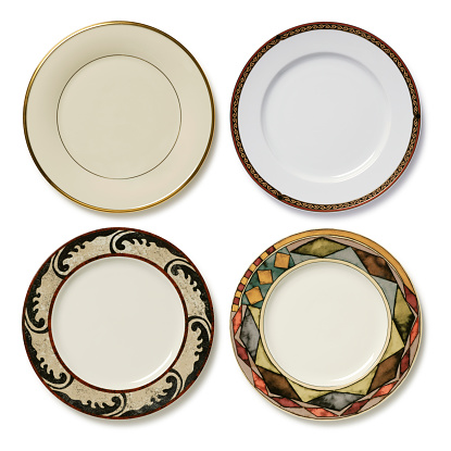 Four elegant dinner plates on white with soft shadow. Place your own food on plate