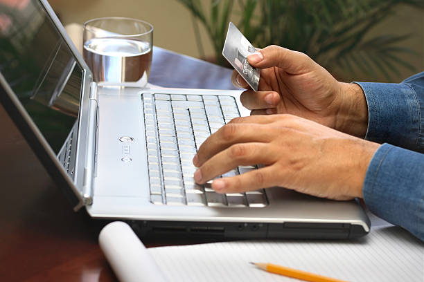 istock Entering credit card information on laptop 172297080