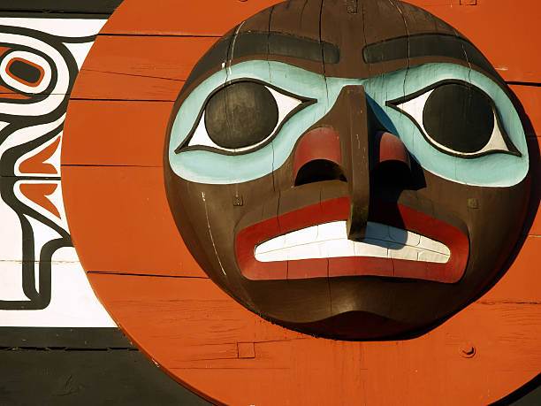 Totem face, Vancouver "Totem in Stanley Park, Vancouver, BC.  Close-up on face.  \Check out my portfolio for other great totem photos from the Pacific Northwest!" aboriginal art stock pictures, royalty-free photos & images