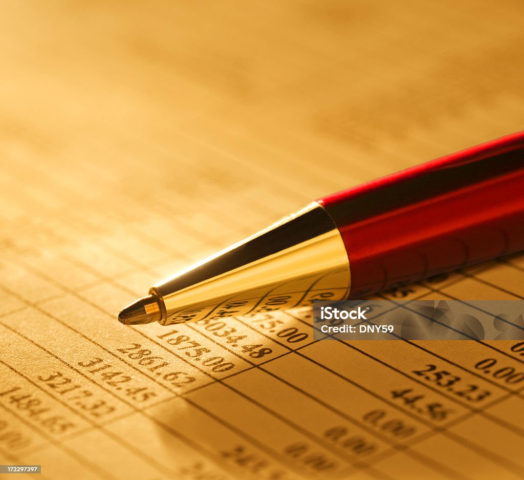 Financial Figures Close Up Close up of pen on a spreadsheet of financial figures. Business Stock Photo