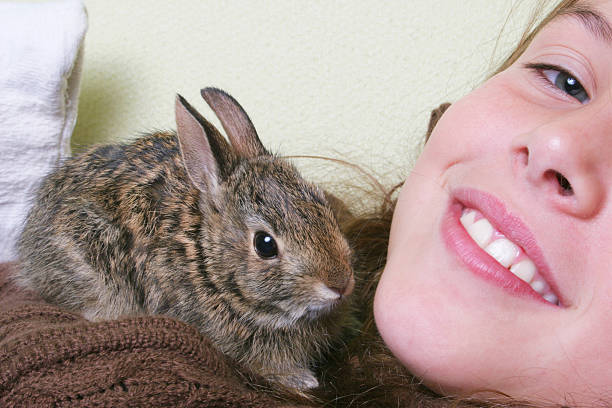 istock Girl with baby hare 172297489