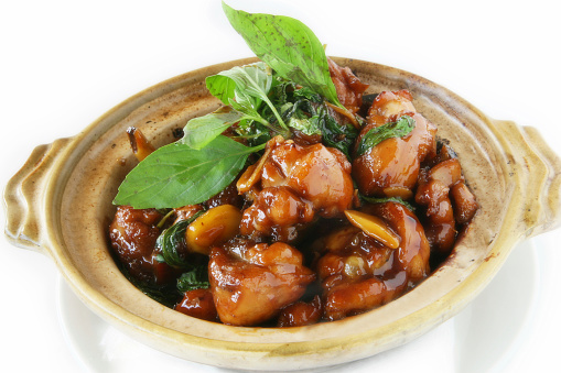 An authentic taiwanese classic dish.  Pieces of chicken stir fried in a special sauce with basil leaves.