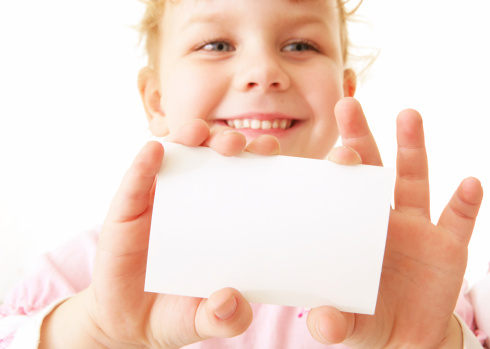 Young girl holding business card