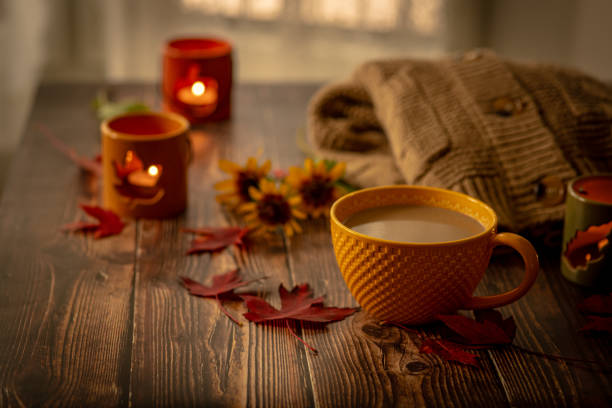 istock Coffee with milk in a yellow mug. Autumn cozy background 1722983300
