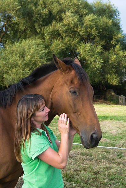istock Women and horse 172298734