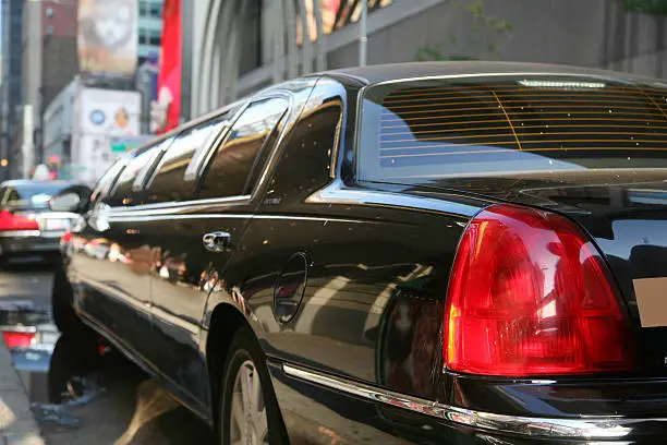 Tail light of black limousine in Times Square, New York City, New York, USA.