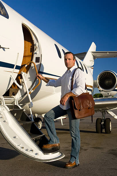 istock Affluent Travel-Man Boarding Private Jet 172299478