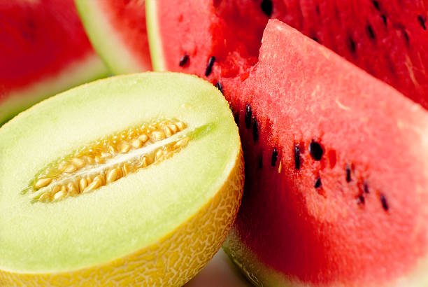 Close up of sliced melon and watermelon Cantaloupe and watermelons slices melon photos stock pictures, royalty-free photos & images