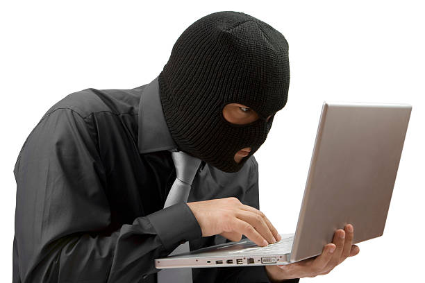 uomo, rubare dati da un computer portatile isolato - business stealing top secret confidential foto e immagini stock