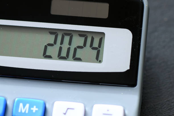 istock 2024 on calculator screen. New year 2024 on the calculator display. 1723009744