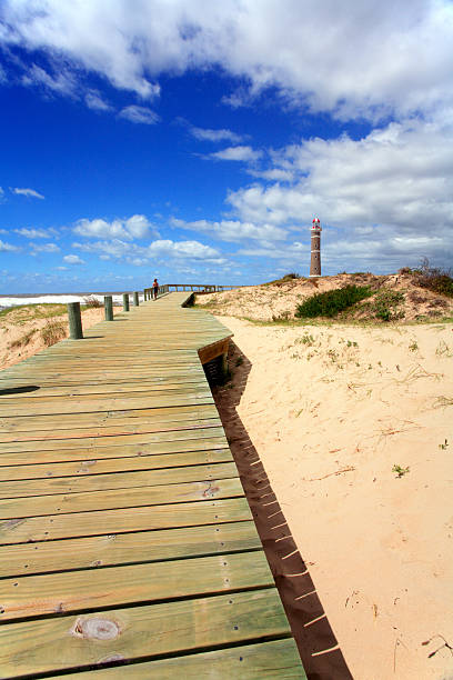 Deck and lighthouse (Jose Inacio -  Punta Del Este) lighthouse at the beach - Jose Inacio - Punta Del Este - Uruguay playas del este stock pictures, royalty-free photos & images