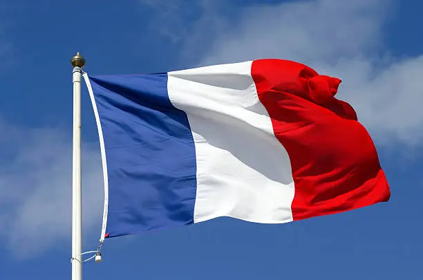 French flag blowing in the wind.