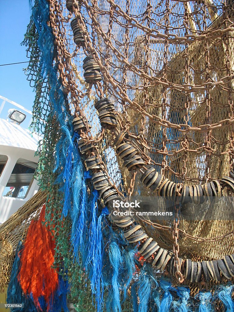 fishing net "close-up of a Dutch commercial fishing trawler with fishing net, chains and other professional fishing equipment of Zeeland in The Netherlands.Other fishing stock photos:" Abstract Stock Photo