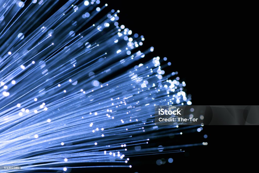 Fiber optic cables reaching outwards Blue fiber optics. Fiber Optic Stock Photo