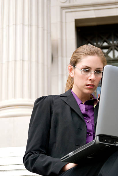 istock Business woman on laptop by columns 172303341