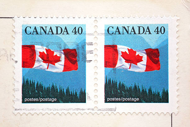 istock Two stamps showing Canadian flag on white postcard 172303465