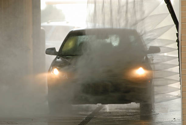 Rotating brush, part of an exterior rollover car wash unit (very common at gas stations), while rinsing the car.
