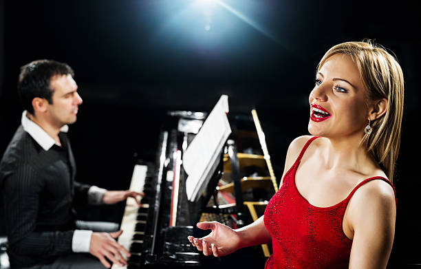 istock Elegant woman singing with a pianist 172304618