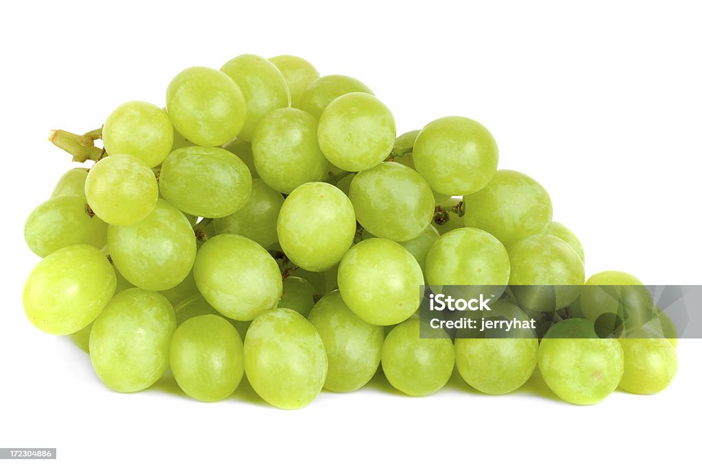 Bunch of Green Grapes laying A shot of a bunch of green grapes, laying and isolated on white. Grape Stock Photo