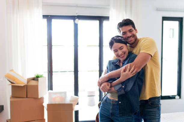 istock Young couple embracing at the new home 1723049455