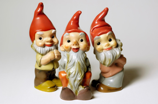 Three happy little fellas. Vintage garden gnomes from the fifties. Also see this shot of similar gnomes...