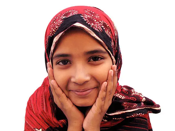 Photo of Little girl wearing head scarf and smiling