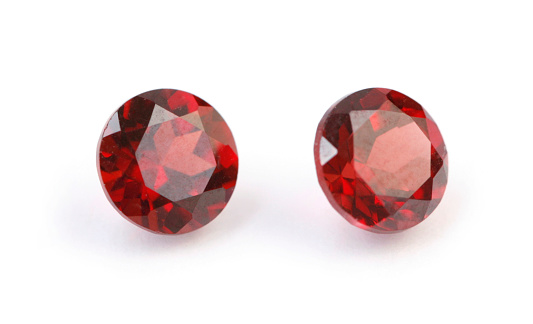 Two deep red gemstones. Almandine garnet.Click the image for gemstone photos: