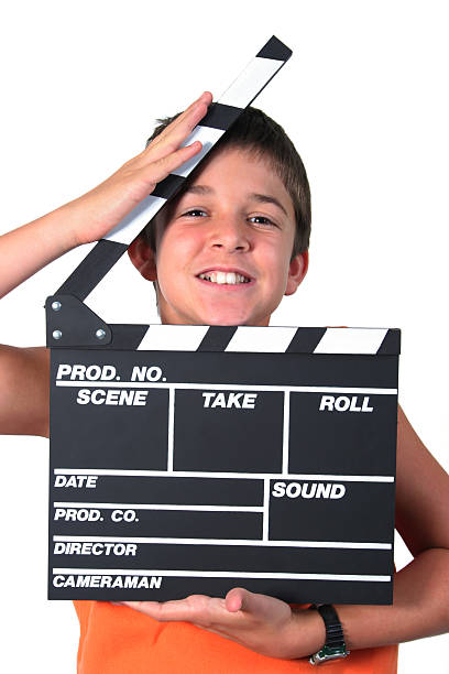 istock Boy and film slate 172306840