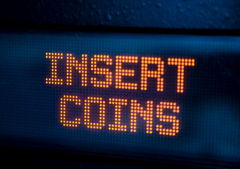 insert coins text on led display