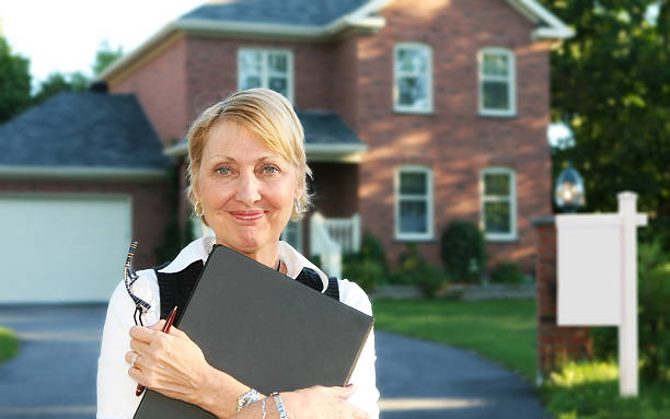 istock A real estate agent holding a file  172307461